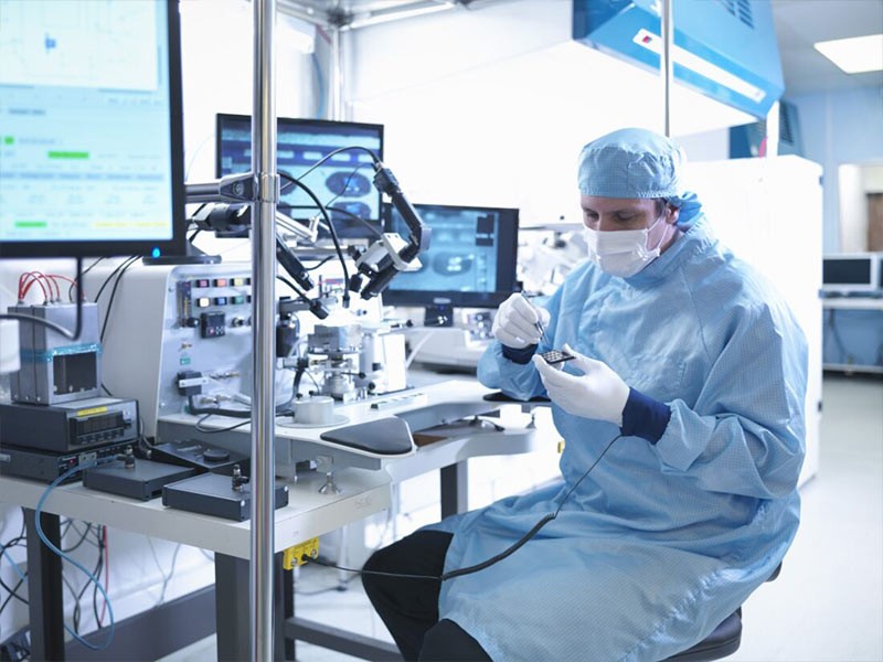 Researcher doing the tests in microchips during their research in the Life science research laboratory