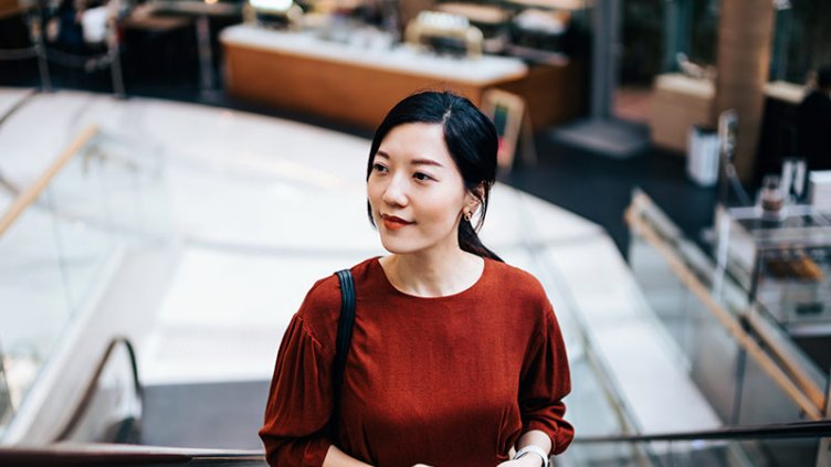 Young girl on a escalator