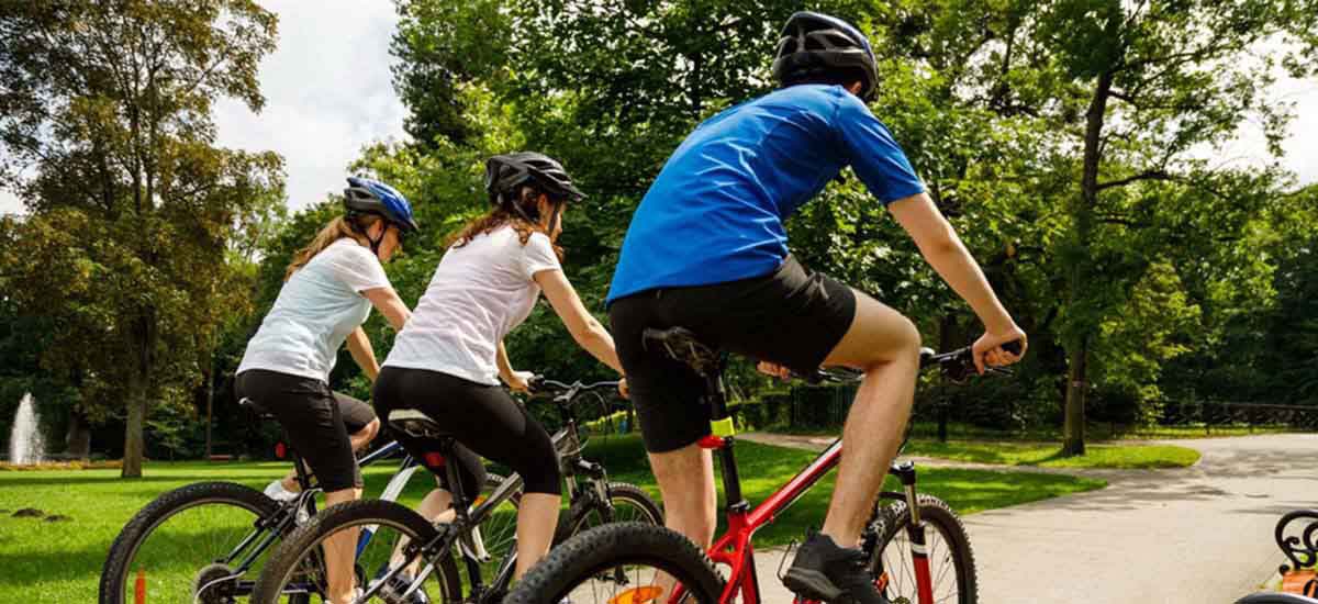 Three children riding their bicycle