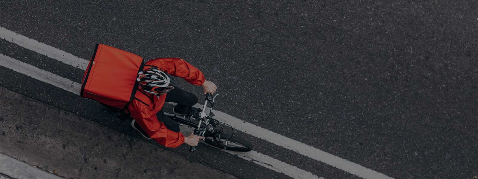 Delivery boy riding a bike