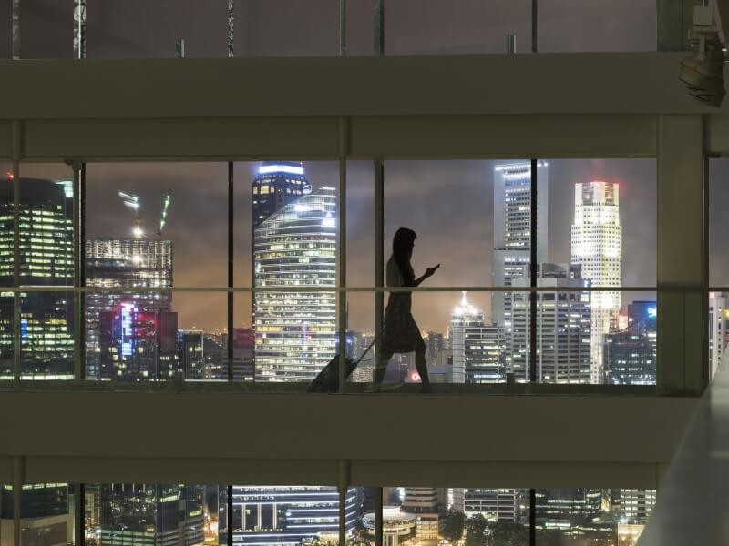 A woman going inside the hotel for check in