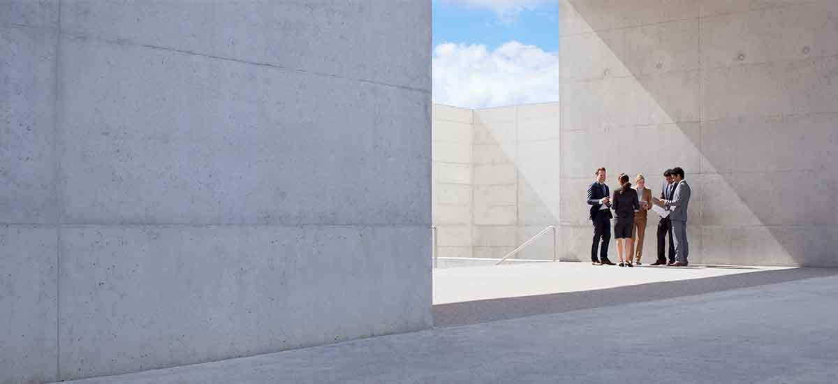 Business people meeting outside modern building