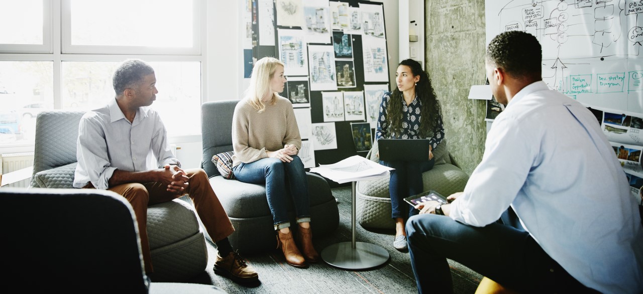 Businesswoman leading informal meeting