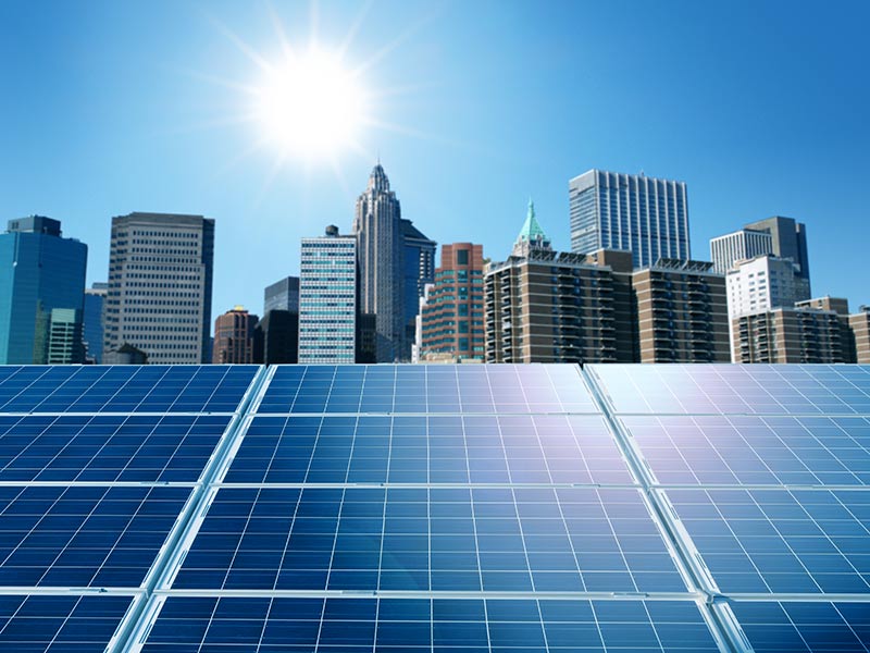 View of skyscrappers along with solar panels